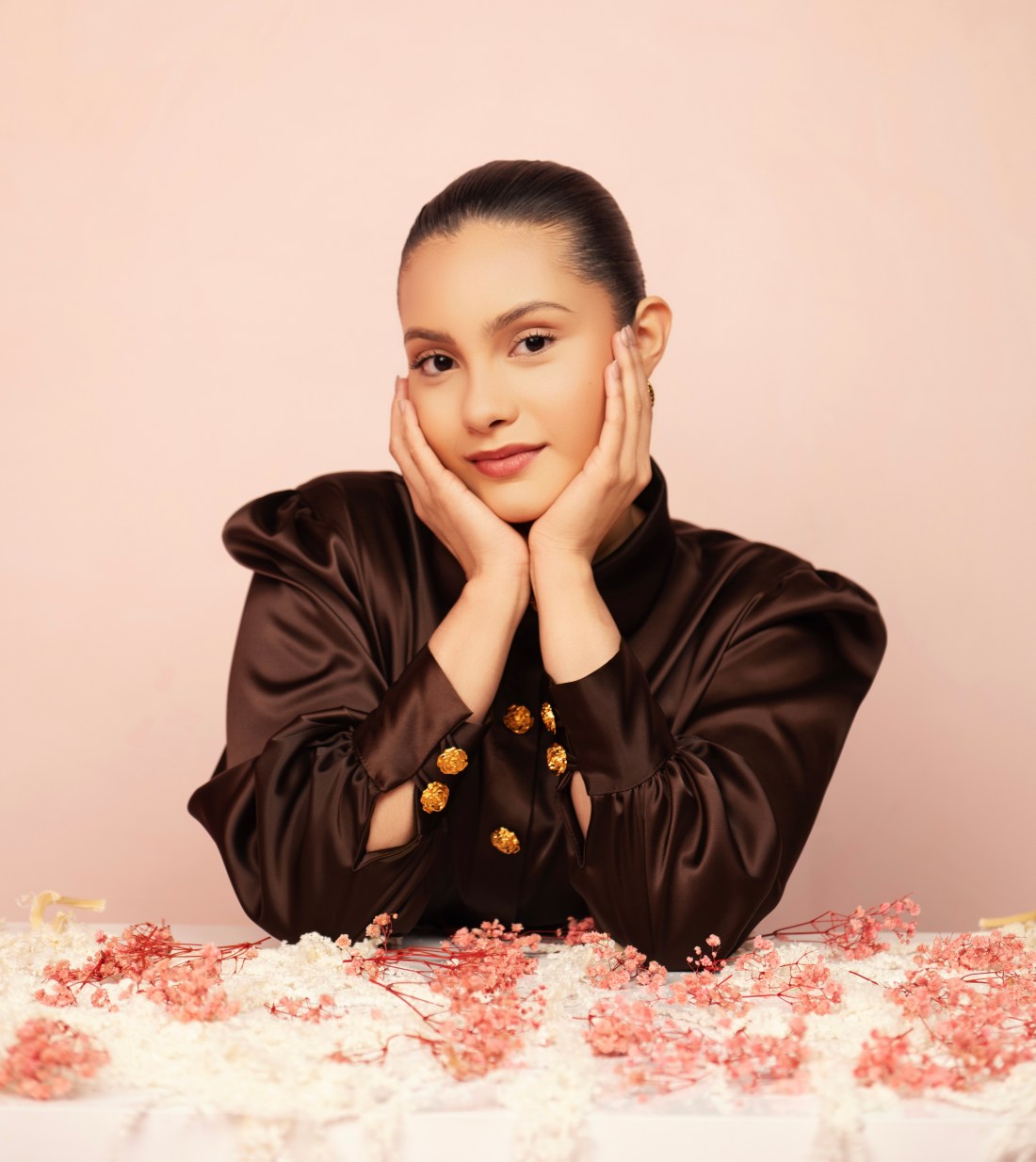 Sierra’s Storybook campaign portrait with pink flower petals